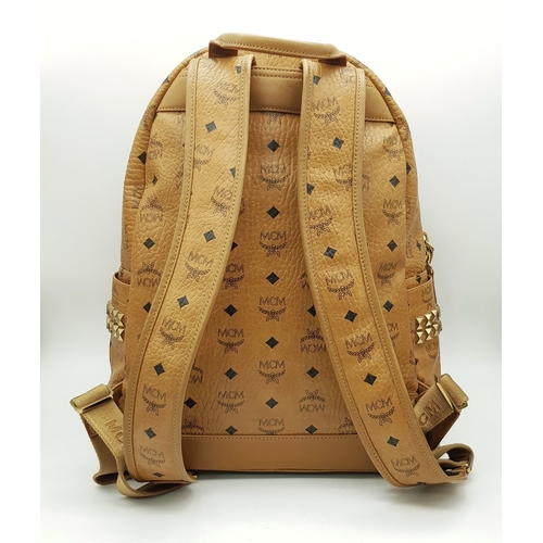 5 - An MCM Visetos Large Stark Backpack. Cognac MCM monogram coated canvas exterior with gold-toned hard... 