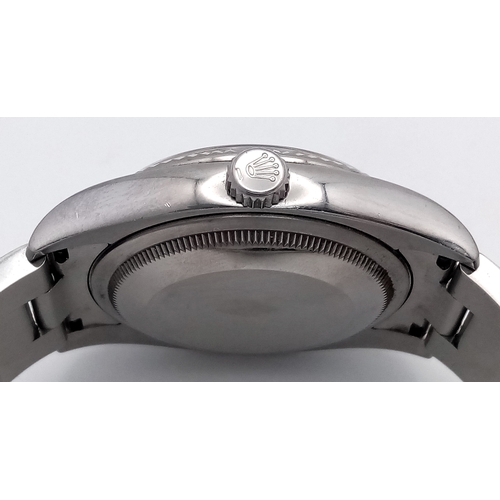 47 - A Rolex Datejust Automatic Gents Watch. Model 116234. Stainless steel bracelet and case - 36mm. Ice ... 