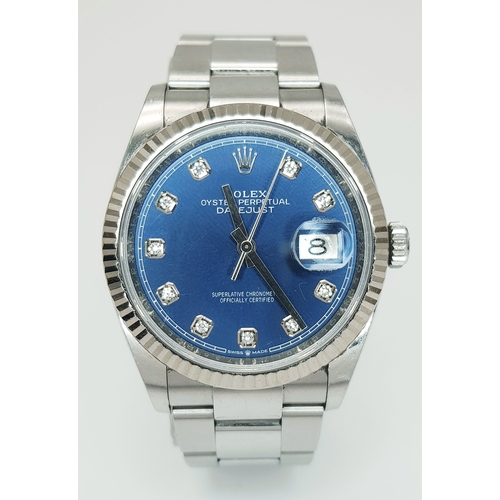 An Ice Blue and Diamond Dial Rolex Datejust Automatic Watch. Model 126234. Stainless steel bracelet and case - 36mm. Fluted bezel. Blue dial with diamond makers. Comes with box, spare links and papers. In good condition and working order. Ref: 028433.