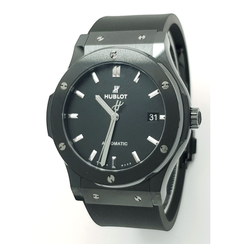 A Hublot Classic Fusion Automatic Gents Watch. Black rubber dial. Polished ceramic case - 42mm. Model 511.CM.1171.RX. Black dial with date window. Skeleton back. Comes with box and WCSA/Watch Register Report. In good condition and working order. Ref: 028997.
