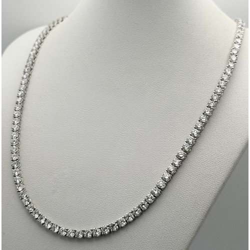 26 - A W.G.I Certified 10K White Gold, Diamond Tennis Necklace. Set with 114 round brilliant lab grown di... 