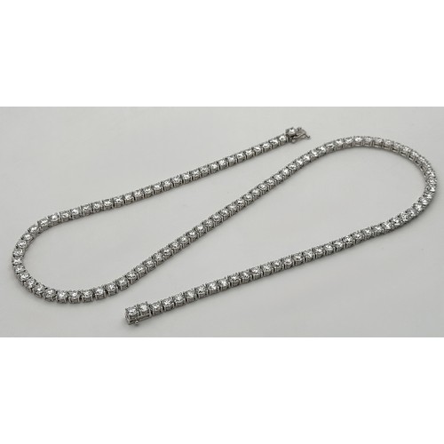 26 - A W.G.I Certified 10K White Gold, Diamond Tennis Necklace. Set with 114 round brilliant lab grown di... 