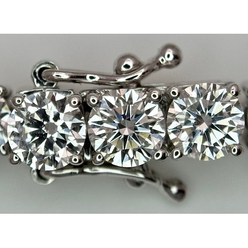 26 - A W.G.I Certified 10K White Gold, Diamond Tennis Necklace. Set with 114 round brilliant lab grown di... 