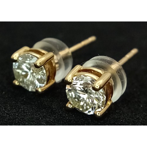 509 - A Pair of 18K Yellow Gold and Diamond Stud Earrings. 0.80ctw of round brilliant cut diamonds having ... 