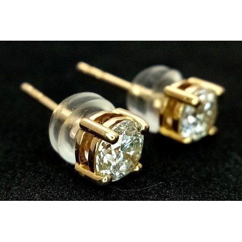 509 - A Pair of 18K Yellow Gold and Diamond Stud Earrings. 0.80ctw of round brilliant cut diamonds having ... 