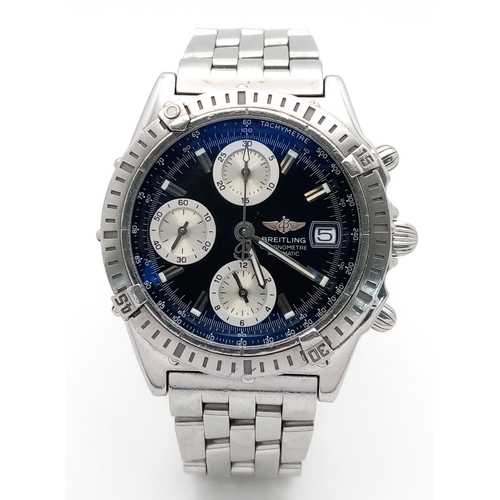 A Breitling Chronomat Automatic Gents Watch. Model A13352. Stainless steel bracelet and case - 39mm. Black dial with three sub dials. Rotating bezel. In working order. Comes with a WCSA report. Ref: 029604.