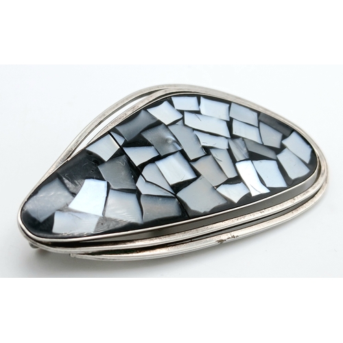 42 - A vintage 925 silver Mosaic style Mother of Pearl inlaid brooch. Total weight 9.5G. Total length 6.5... 