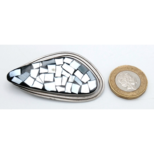 42 - A vintage 925 silver Mosaic style Mother of Pearl inlaid brooch. Total weight 9.5G. Total length 6.5... 