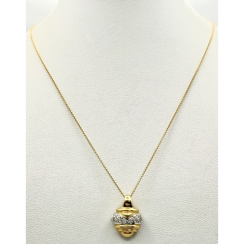 16 - An 18K Yellow and White Gold Diamond Pendant with Figure 8 Safety Catch Clasp. Comes with 18K Yellow... 