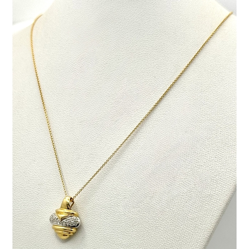 16 - An 18K Yellow and White Gold Diamond Pendant with Figure 8 Safety Catch Clasp. Comes with 18K Yellow... 