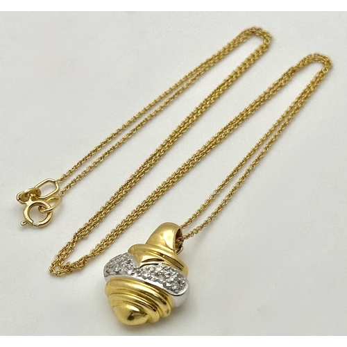 16 - An 18K Yellow and White Gold Diamond Pendant with Figure 8 Safety Catch Clasp. Comes with 18K Yellow... 