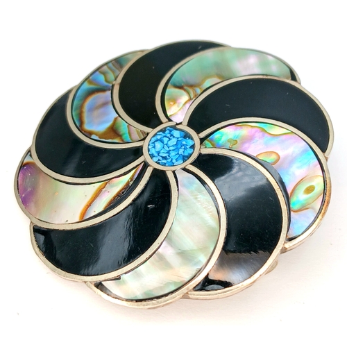 55 - A Mexican silver Mother of Pearl inlaid enamelled spiral brooch. Total weight 6.3G. Total length 4.5... 