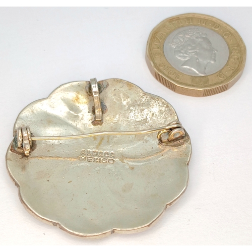 55 - A Mexican silver Mother of Pearl inlaid enamelled spiral brooch. Total weight 6.3G. Total length 4.5... 