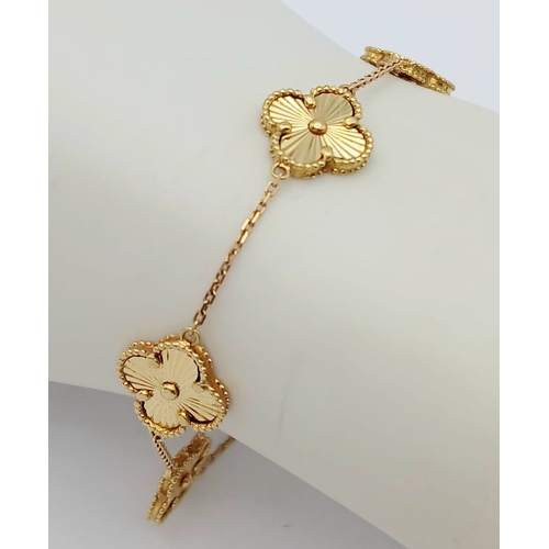 27 - AN 18K YELLOW GOLD, CLOVER DESIGN, BRACELET. 7.6G. SC 7070