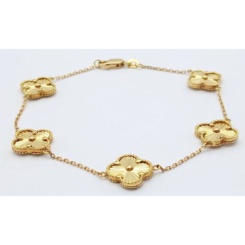 27 - AN 18K YELLOW GOLD, CLOVER DESIGN, BRACELET. 7.6G. SC 7070