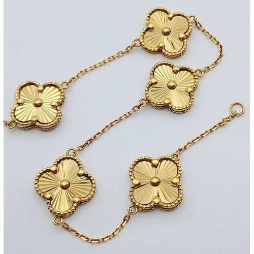 27 - AN 18K YELLOW GOLD, CLOVER DESIGN, BRACELET. 7.6G. SC 7070