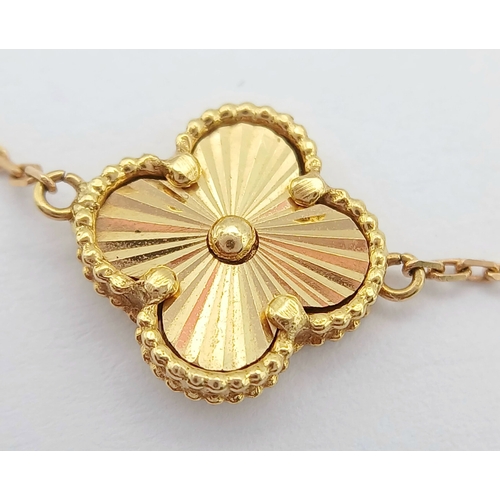 27 - AN 18K YELLOW GOLD, CLOVER DESIGN, BRACELET. 7.6G. SC 7070