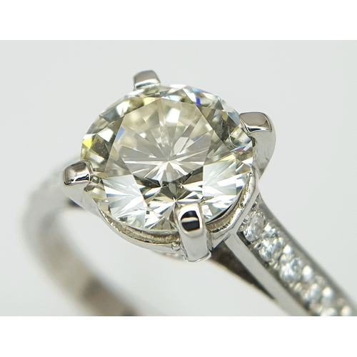 58 - An 18K White Gold Diamond Solitaire Ring. A 1.70ct round brilliant cut diamond having J colour and a... 