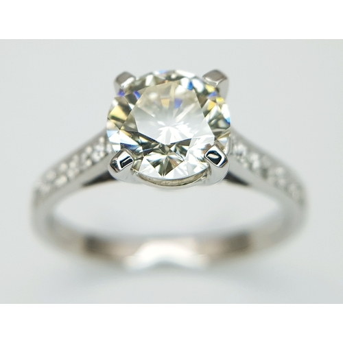 58 - An 18K White Gold Diamond Solitaire Ring. A 1.70ct round brilliant cut diamond having J colour and a... 