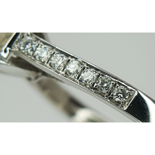 58 - An 18K White Gold Diamond Solitaire Ring. A 1.70ct round brilliant cut diamond having J colour and a... 