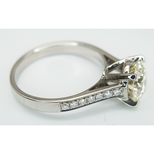 58 - An 18K White Gold Diamond Solitaire Ring. A 1.70ct round brilliant cut diamond having J colour and a... 