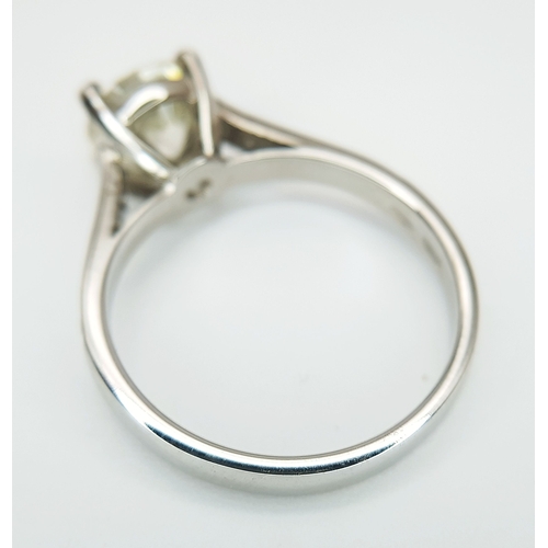 58 - An 18K White Gold Diamond Solitaire Ring. A 1.70ct round brilliant cut diamond having J colour and a... 