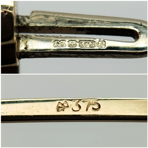 50 - A 9K Yellow Gold Twist Bangle. 14mm widest part. Clip open design. Two small dings. 55mm inner diame... 