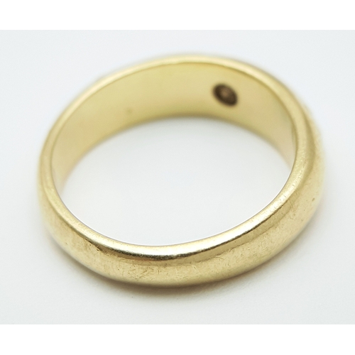 43 - An 18K Yellow Gold (tests as) Diamond Set Band Ring. 0.15ct deep-set round cut diamond. 5.5g total w... 