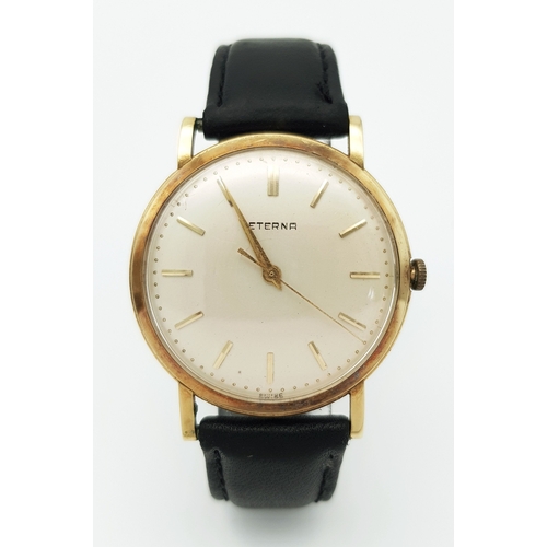 46 - A Vintage 18K Gold Eterna Mechanical Gents Watch. Black leather strap. 18K Gold case - 34mm. Swiss m... 