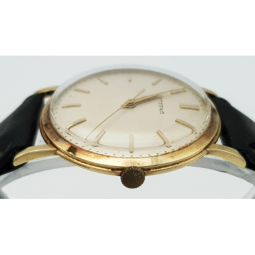 46 - A Vintage 18K Gold Eterna Mechanical Gents Watch. Black leather strap. 18K Gold case - 34mm. Swiss m... 