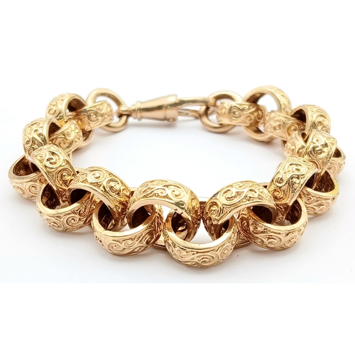 51 - A Chunky 9K Gold Statement Bracelet with Circular, Intricate Pattern Engraved Links. Large lobster c... 