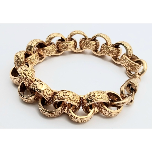 51 - A Chunky 9K Gold Statement Bracelet with Circular, Intricate Pattern Engraved Links. Large lobster c... 