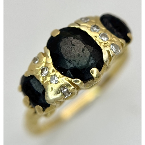 8 - A Vintage 18K Yellow Gold, Sapphire and Diamond Ring. Circa 2.5ctw of oval cut sapphires with round ... 