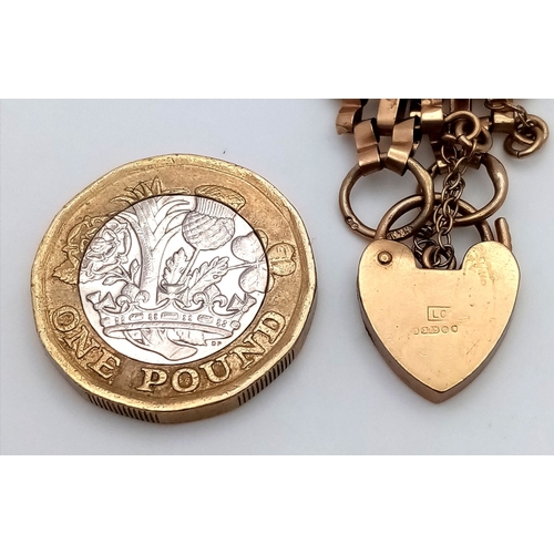 29 - A Vintage 9K Yellow Gold Gate Bracelet with Heart Clasp and safety chain. 11mm width. 18cm. 12.2g.