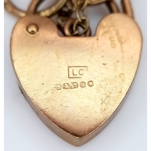 29 - A Vintage 9K Yellow Gold Gate Bracelet with Heart Clasp and safety chain. 11mm width. 18cm. 12.2g.