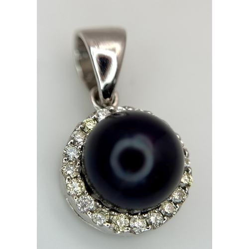 19 - A 14K White Gold Pendant with Black Pearl and Diamond Surround. c. 0.20ctw diamonds. 2cm. 2.95g tota... 