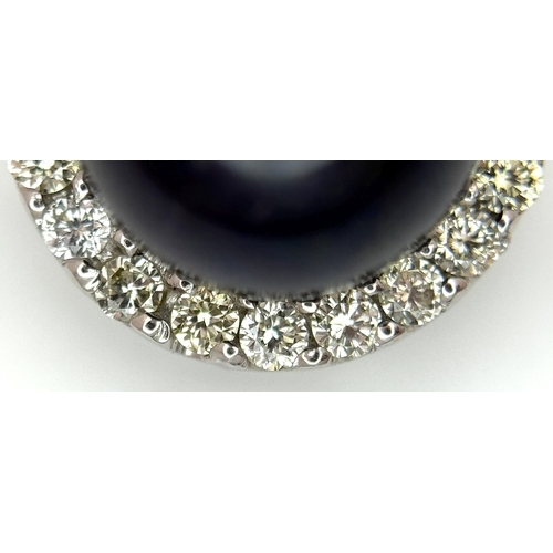 19 - A 14K White Gold Pendant with Black Pearl and Diamond Surround. c. 0.20ctw diamonds. 2cm. 2.95g tota... 