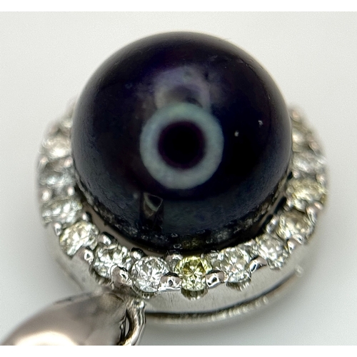 19 - A 14K White Gold Pendant with Black Pearl and Diamond Surround. c. 0.20ctw diamonds. 2cm. 2.95g tota... 