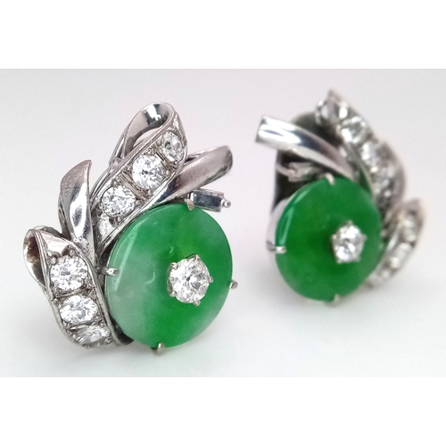 197 - A Stunning Pair of Jade and Diamond Earrings - Each having a circular jade piece with a 0.20ct round... 