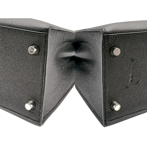 79 - A Highly Collectable Hermes Black Kelly 28 Bag. Epsom leather exterior with silver-toned hardware to... 