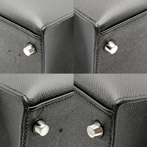 79 - A Highly Collectable Hermes Black Kelly 28 Bag. Epsom leather exterior with silver-toned hardware to... 