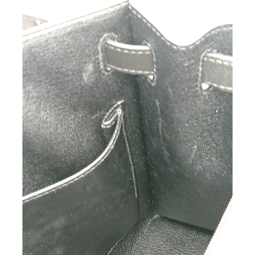 79 - A Highly Collectable Hermes Black Kelly 28 Bag. Epsom leather exterior with silver-toned hardware to... 