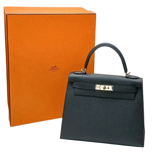 79 - A Highly Collectable Hermes Black Kelly 28 Bag. Epsom leather exterior with silver-toned hardware to... 