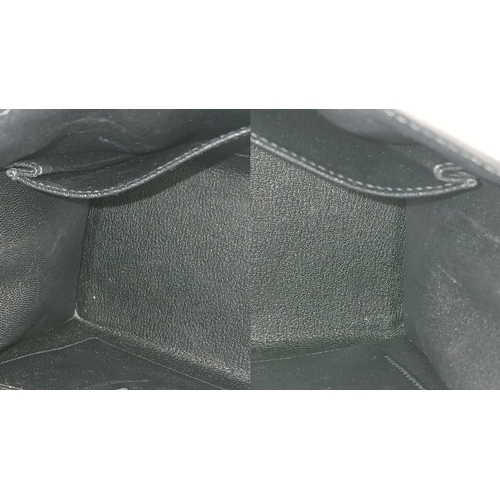 79 - A Highly Collectable Hermes Black Kelly 28 Bag. Epsom leather exterior with silver-toned hardware to... 