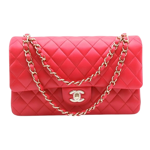 A Chanel Dark Pink Medium Double Flap Bag. Matelasse quilted leather exterior with gold-toned hardware, chain and leather strap, open pocket to back, and press stud and postman's lock closure. Zipped pocket to inner flap. Dark pink leather interior with two open inner side pockets, open slip pocket and an open compartment to front. Comes with box, dust cover and care booklet. Approximately 25.5 cm length x 15.5 cm height. In very good condition overall - please see photos or request a condition report. Ref: 024971