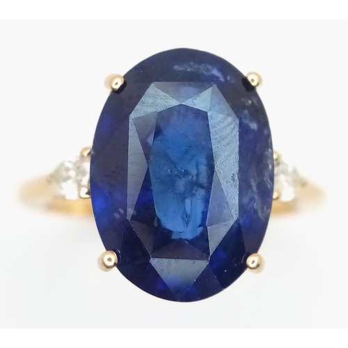 144 - An IGI Certified 18K Yellow Gold (tests as) Sapphire and Diamond Cocktail Ring. An 8.05ct natural ov... 