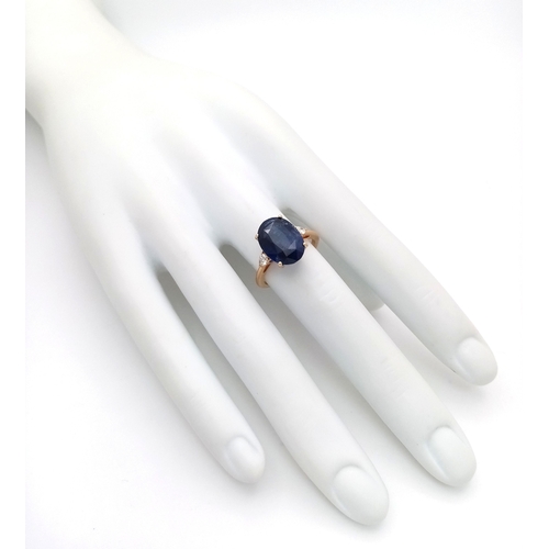144 - An IGI Certified 18K Yellow Gold (tests as) Sapphire and Diamond Cocktail Ring. An 8.05ct natural ov... 