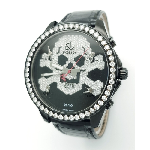 A Jacob and Co. Five Time, Skull Limited Edition Quartz Gents Watch. Black leather strap with black PVD monogram clasp. Stainless steel black PVD case - 47mm. Diamond set bezel. Black dial with diamond encrusted skull and crossbones motif. Four sub-dial date windows - New York, Los Angeles, Paris and Tokyo time zones. Number 5 of 55. In working order.