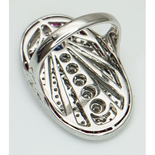 122 - A Head-Turning 18K White Gold Mult-Gemstone Cocktail Ring in Oval Shield Form. A 0.47ct sapphire sit... 