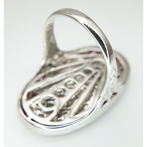 122 - A Head-Turning 18K White Gold Mult-Gemstone Cocktail Ring in Oval Shield Form. A 0.47ct sapphire sit... 